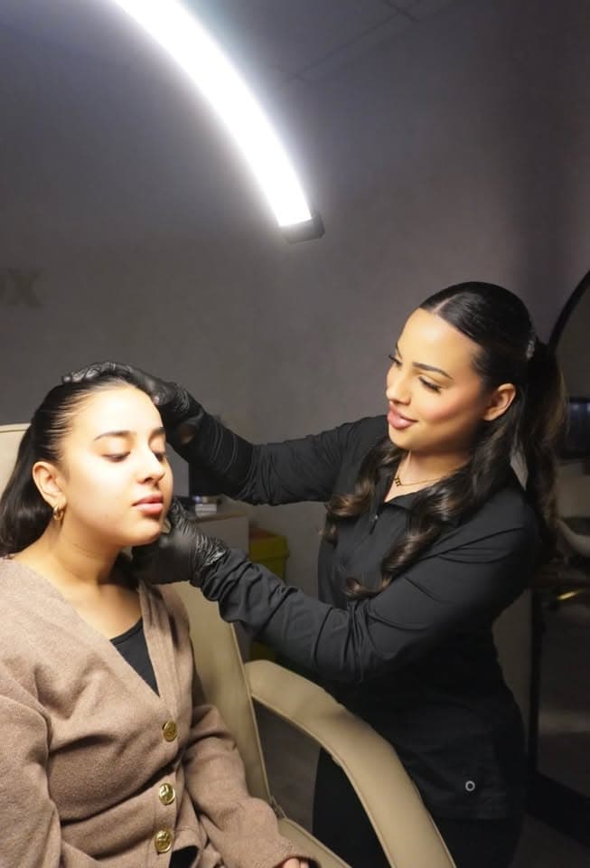 Fatima consulting with a client at Injectox Clinic